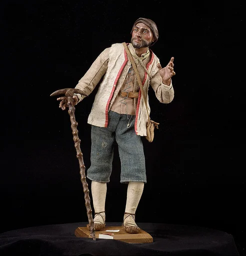 Man with staff and brace of birds