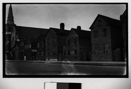 [Row of Two-Story Wooden Houses, Seen from Across Street]