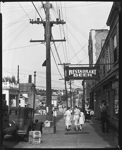 [Sidewalk Scene with Pedestrians and Restaurant Sign, Main Street, Mt. Pleasant, Pennsylvania]
