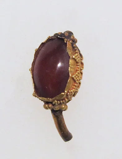 Ring with sard in box setting, figure