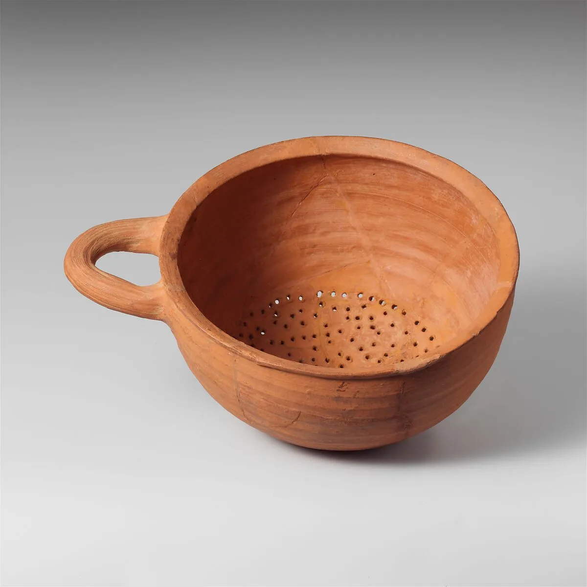 Terracotta hemispherical strainer — Unknown