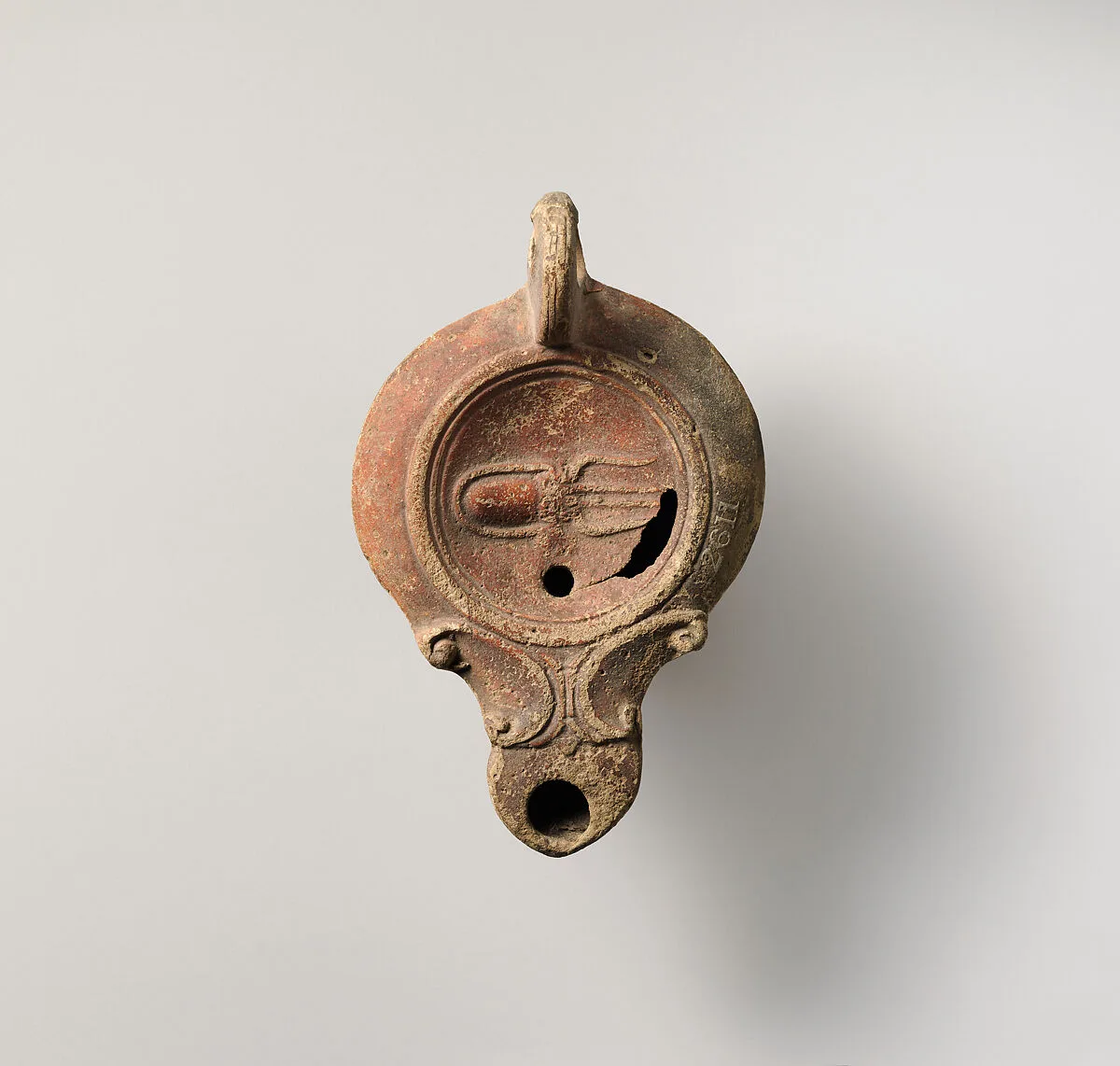 Terracotta oil lamp — Unknown