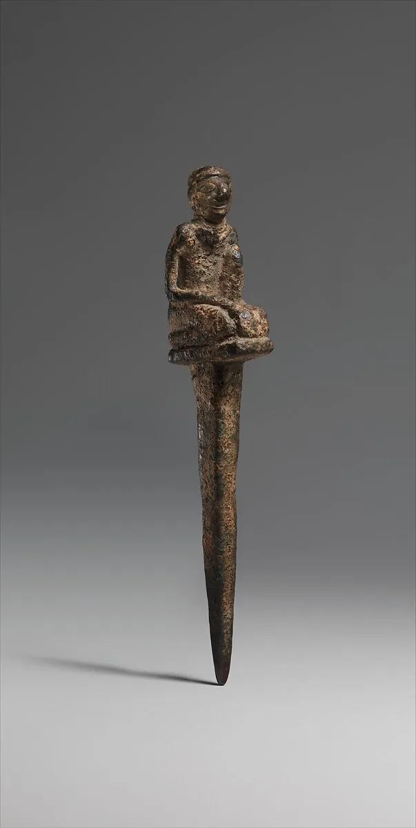 Peg with kneeling male — Unknown