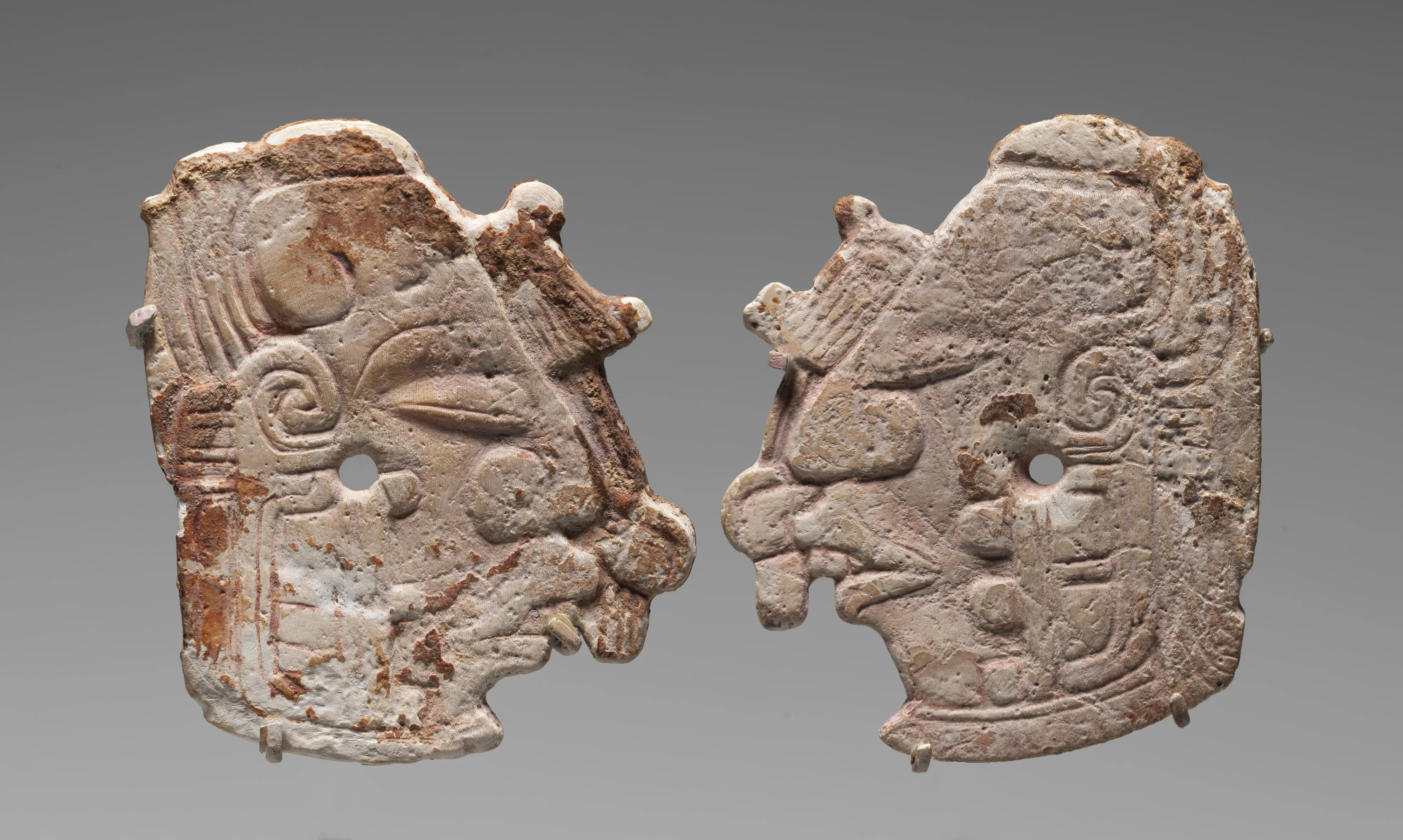 Pair of carved ornaments with the Maize God — Unknown