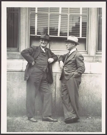[Two Businessmen in Hats Talking on Street, Florida]