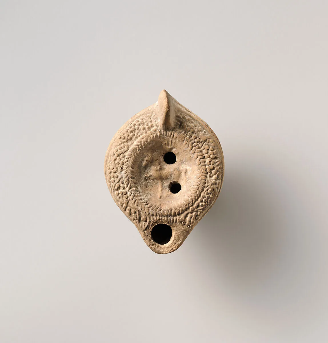 Terracotta oil lamp — Unknown