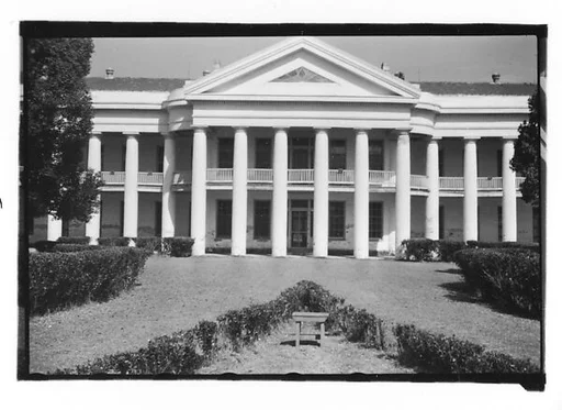 [Façade of Large Greek Revival Building with Lawn Bench in Foreground, Convent, Louisiana]