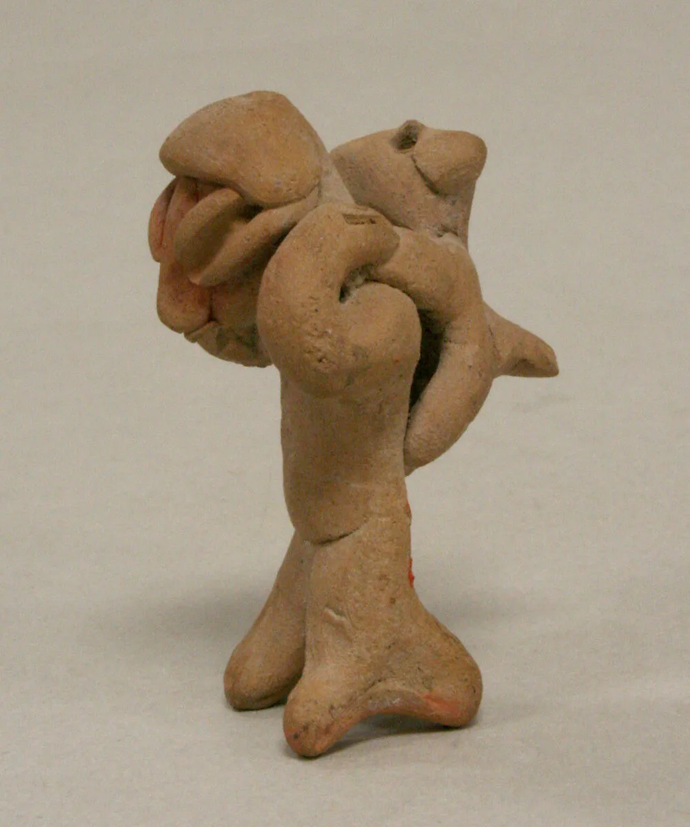 Figure with Animal on Back — Unknown