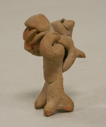 Figure with Animal on Back