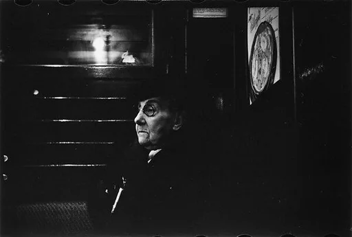 [Two 35mm Film Frames: Subway Passengers, Times Square Shuttle, New York City: Old Woman Wearing Hat and Spectacles; Light Through Subway Grating]