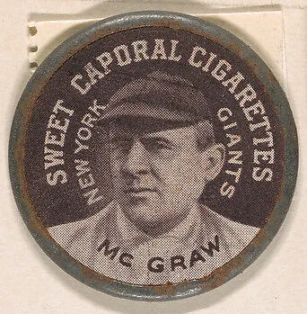 McGraw, New York Giants (black), from the Domino Discs series (PX7), issued by Kinney Brothers — Kinney Brothers Tobacco Company