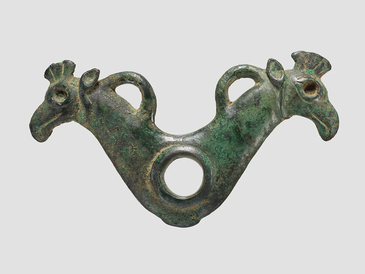 Horse bit cheekpiece in form of addorsed griffin heads — Unknown