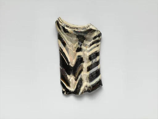 Glass mosaic handle fragment