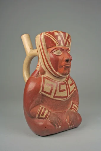 Stirrup spout bottle with dignitary figure