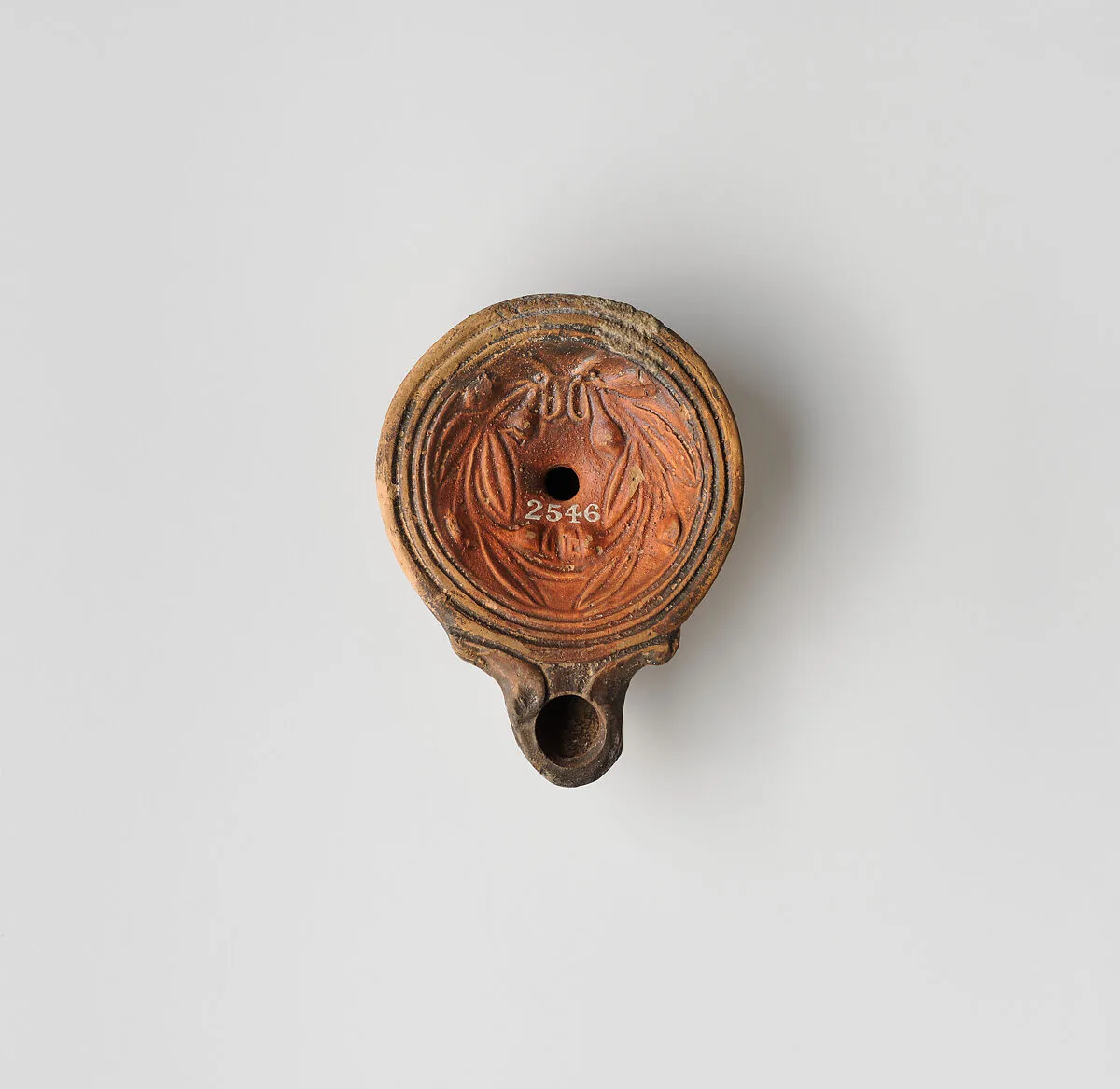 Terracotta oil lamp — Unknown