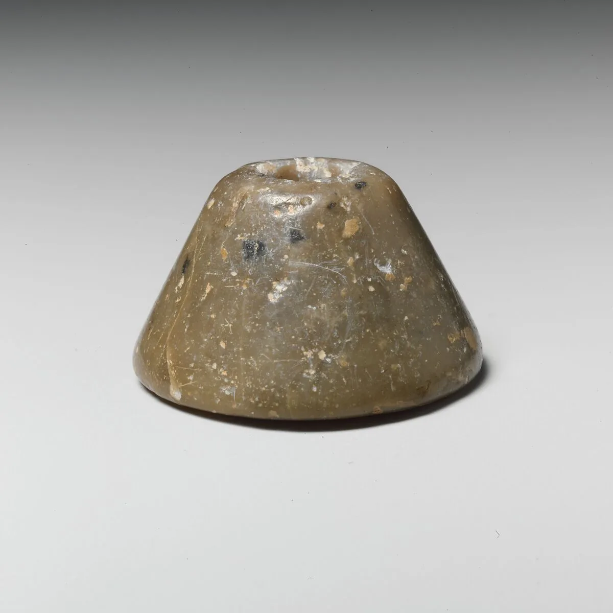Stone spindle whorl — Unknown