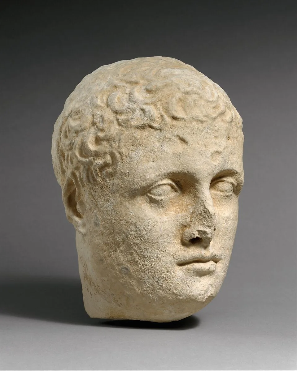 Limestone head of a beardless male votary — Unknown