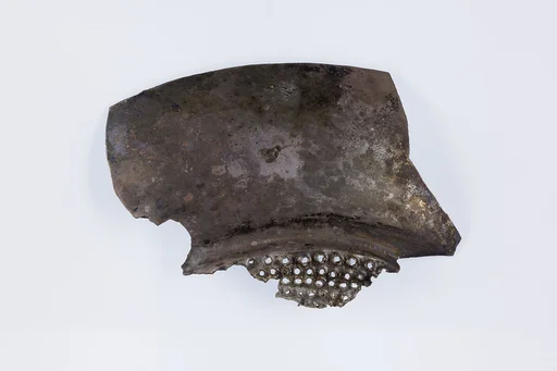Fragment of a shallow strainer
