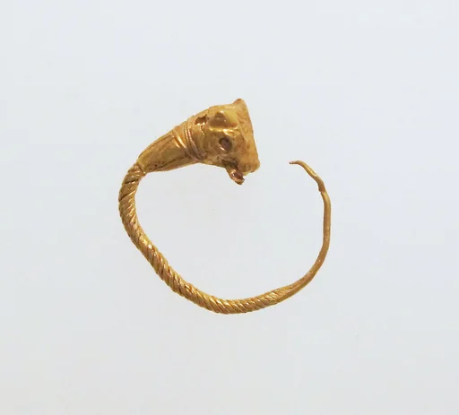 Gold earring with head of a bull