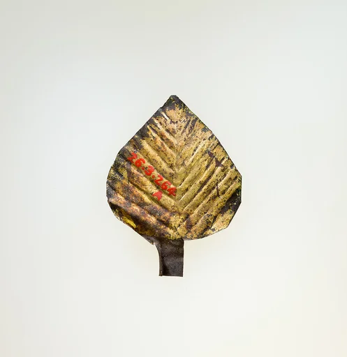 Three gilded leaves from a wreath