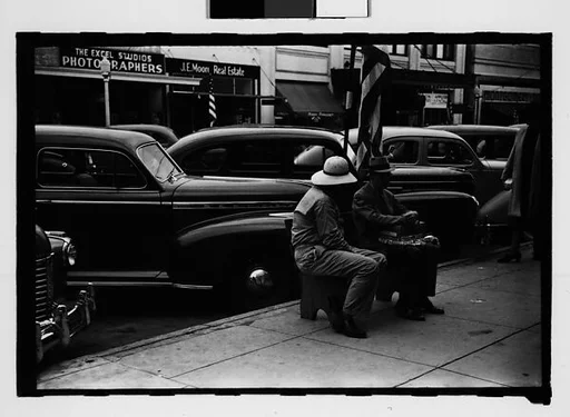 [Three 35mm Film Frames on Uncut Roll: Two Elderly Men Seated on Main Street Sidewalk Bench, Sarasota, Florida]