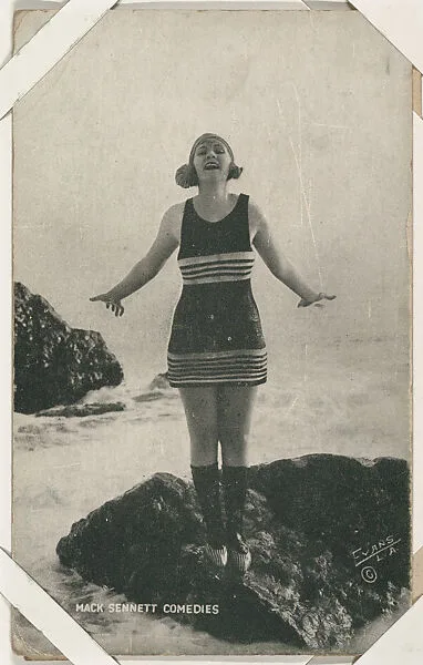 Bathing beauty on rocks with arms outstretched from Mack Sennett Comedies Arcade series (W423) — Unknown