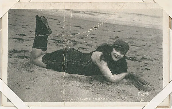 Bathing beauty in costume laying on beach from Mack Sennett Comedies Arcade series (W423) — Unknown