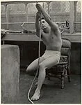 [Male Model Posed Pulling a Rope in Anna Huntington's Rooftop Studio]