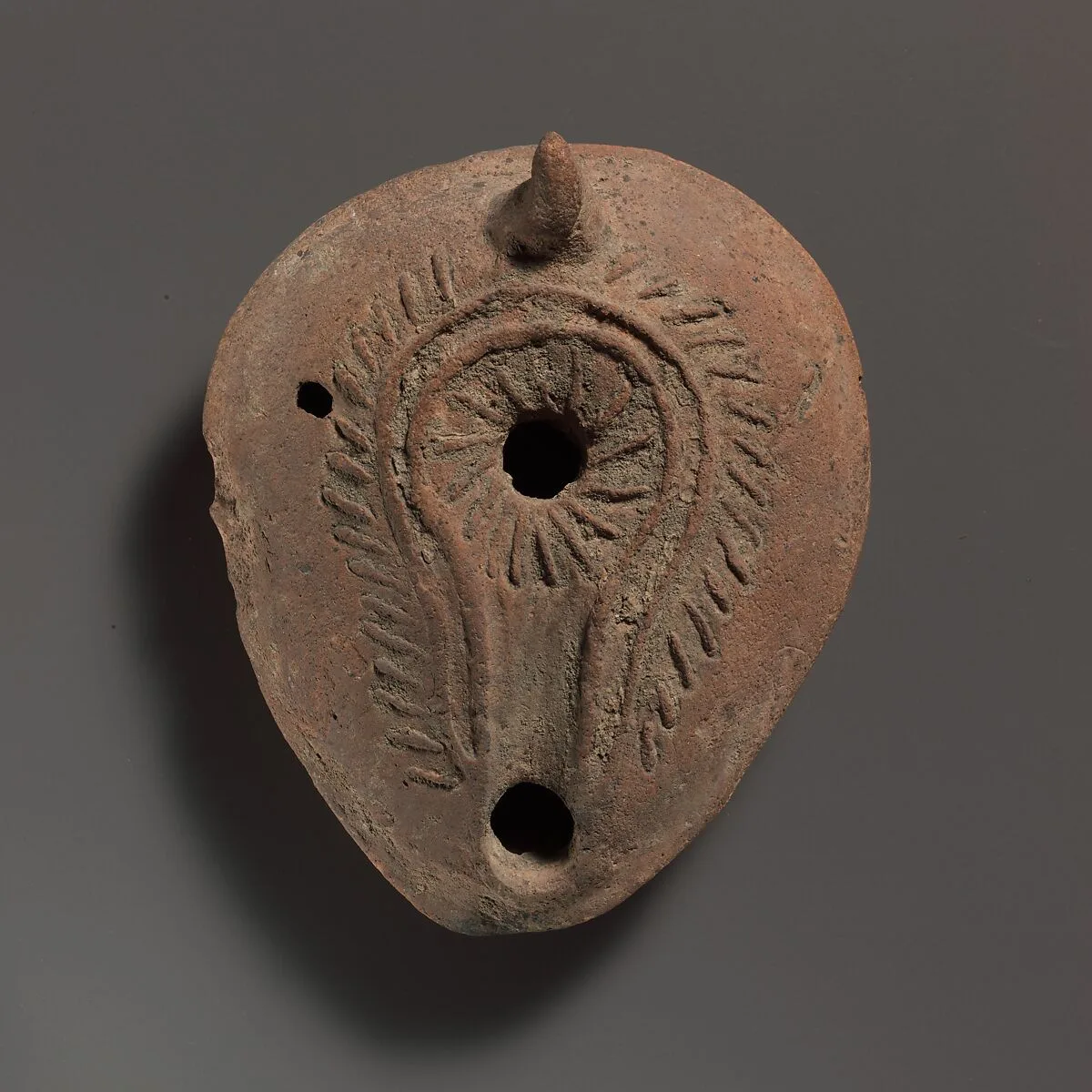 Terracotta oil lamp — Unknown