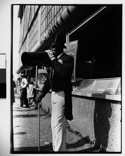 [Barker with Megaphone Outside Food Stand, New York City]