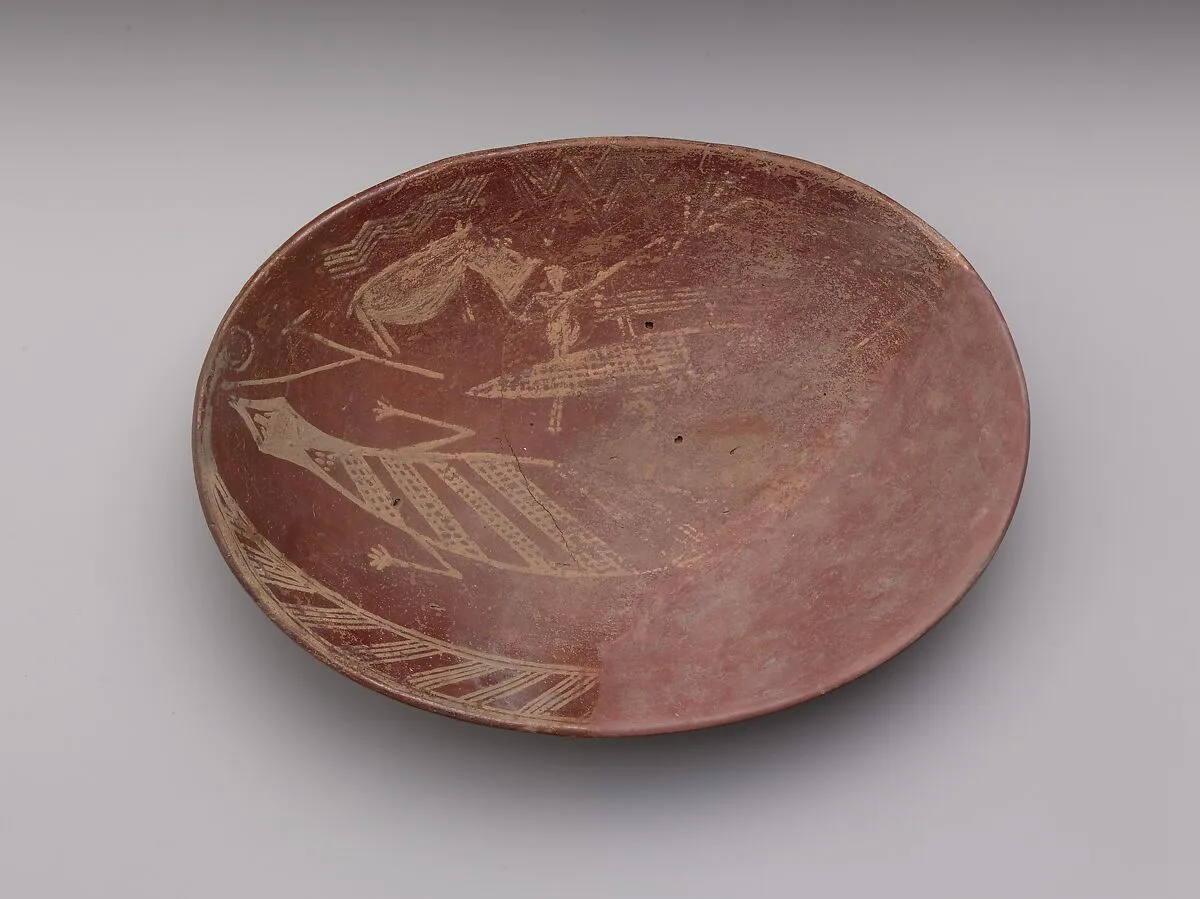 A shallow white cross-lined ware bowl illustrating a man on a boat alongside a hippo and crocodile — Unknown