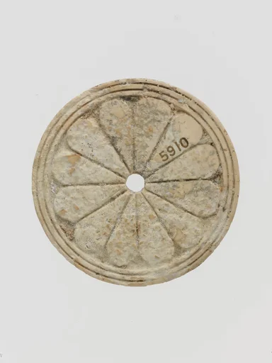 Ivory disk with rosette