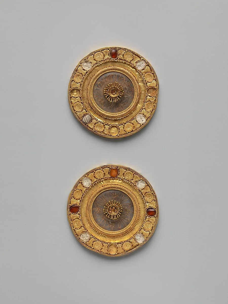 Pair of gold and rock crystal disks, set with garnet and glass inlays — Unknown