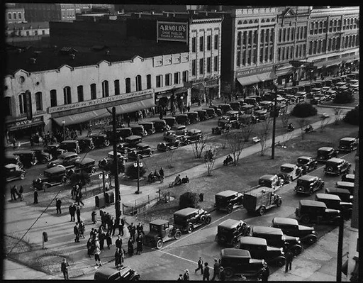 [Stores and Parked Cars on Main Street, From High Elevation, Macon, Georgia]