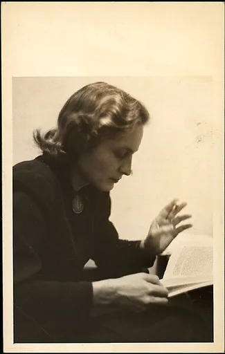 [Eleanor Clark, Reading and Holding Cigarette]