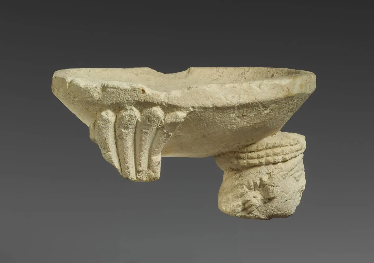 Limestone fragment of a sphinx supporting an incense burner — Unknown