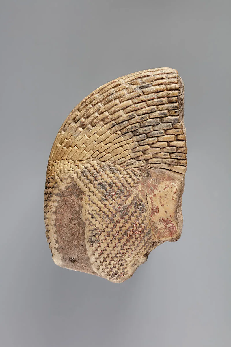 Tile fragment, part of a wig from a figure of the king — Unknown