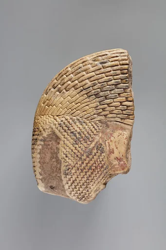 Tile fragment, part of a wig from a figure of the king
