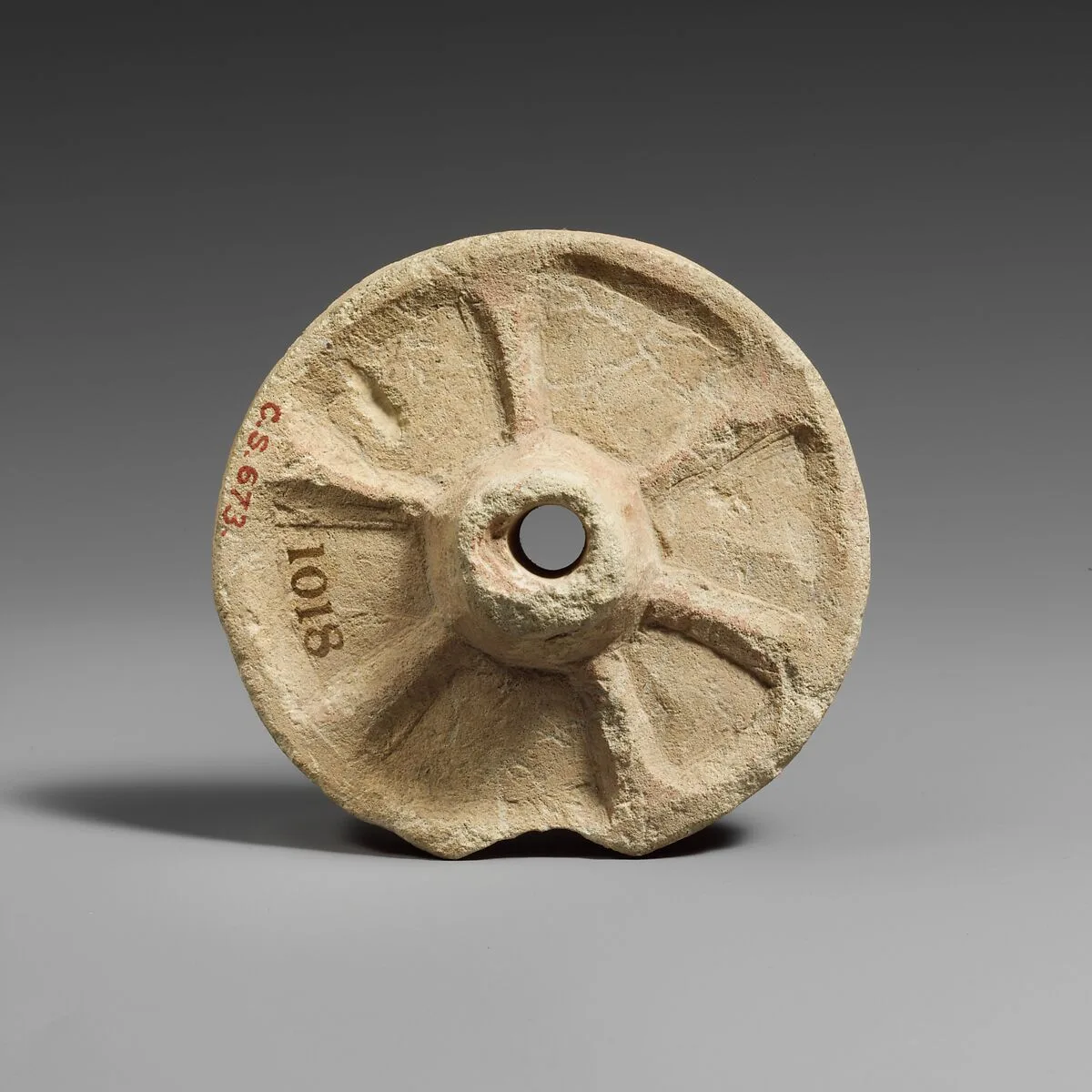 Limestone chariot wheel — Unknown