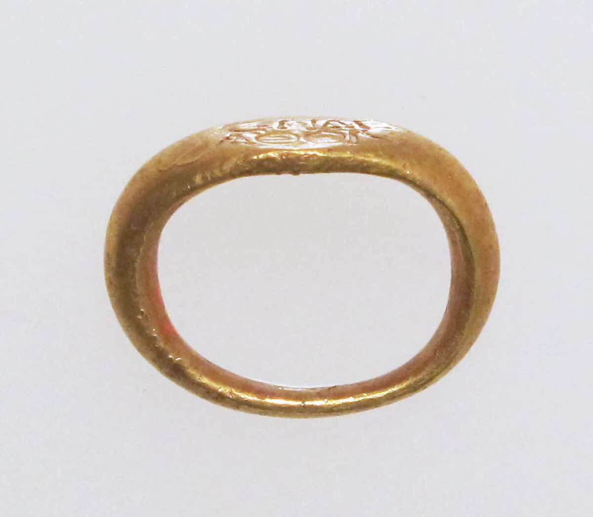 Gold ring with inscribed bezel — Unknown