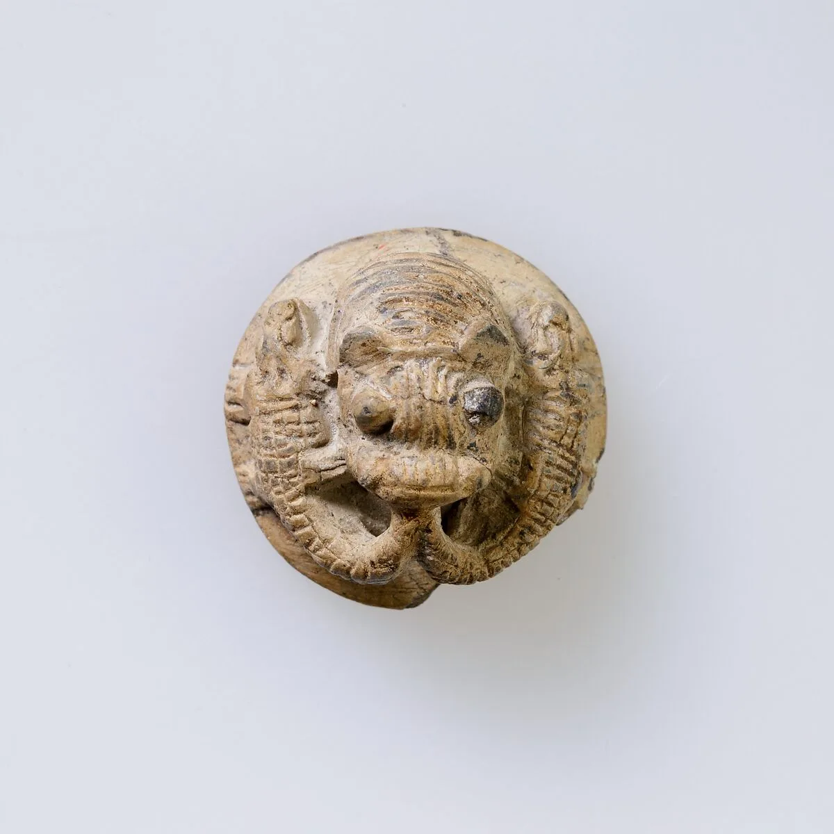 Hippopotamus-Head Design Amulet Inscribed With Four Linked Ibex Heads. — Unknown
