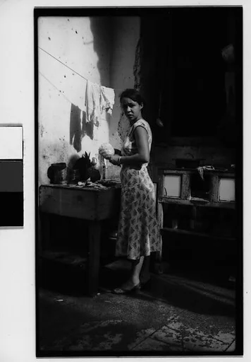 [Woman Preparing Pineapples in Kitchen Courtyard, Havana]