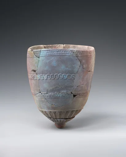 Beaker with tongue and guilloche patterns
