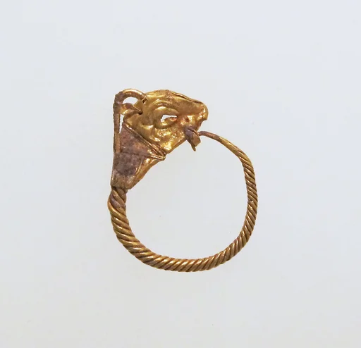 Gold earring with head of a goat