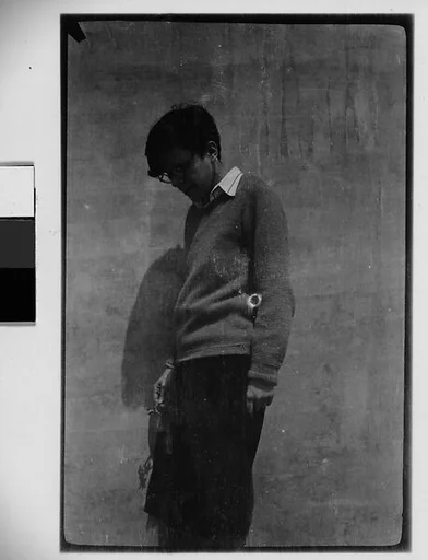 [Woman in Sweater and Horn-Rimmed Glasses]
