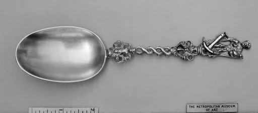 Figure-top spoon