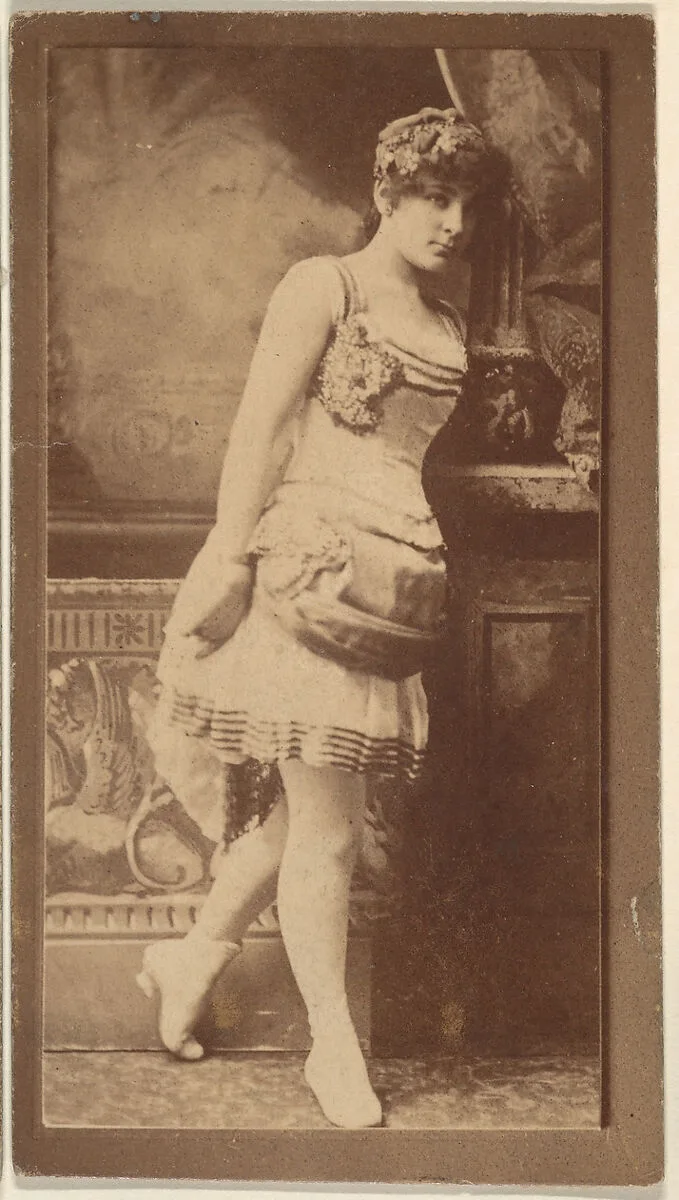 Actress leaning on column, from the Actresses series (N668) — Unknown