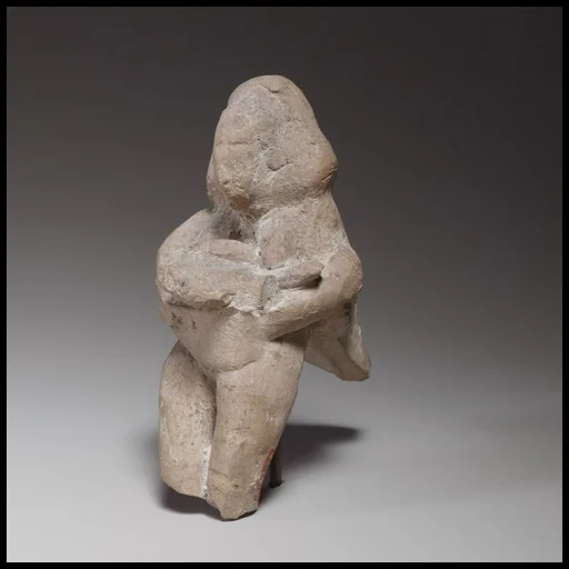 Seated female figurine