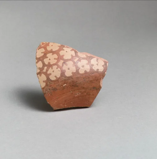 Terracotta vessel fragment with rosettes