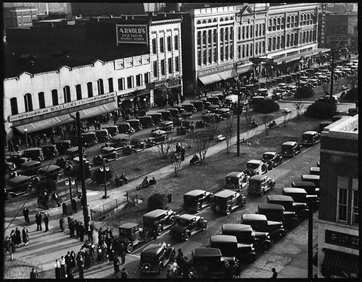 [Stores and Parked Cars on Main Street, From High Elevation, Macon, Georgia]